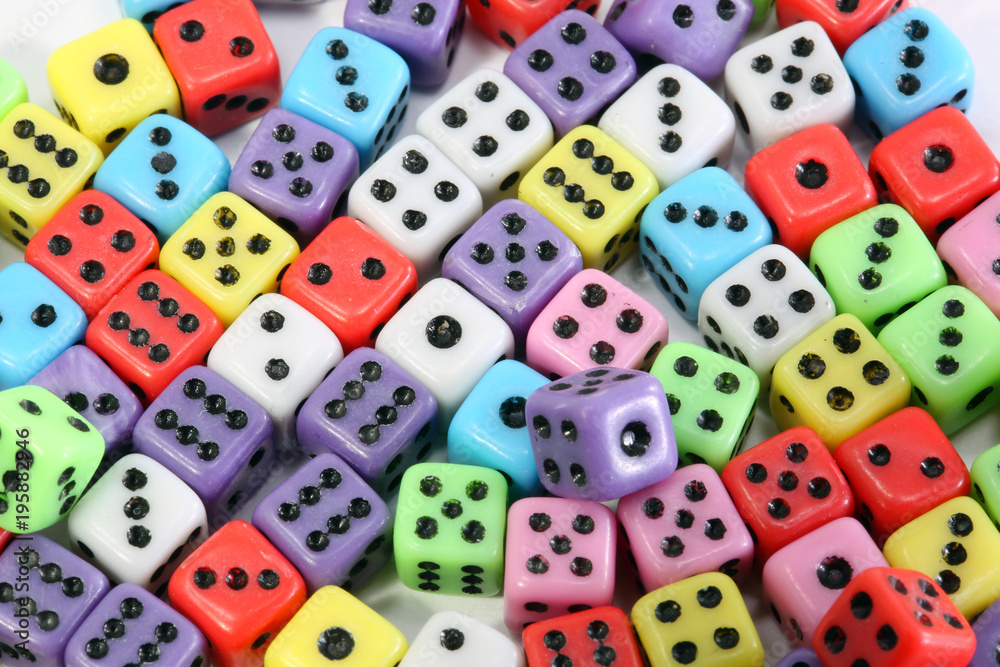 many colored gaming dice with black dots many colored gaming dice with black dots