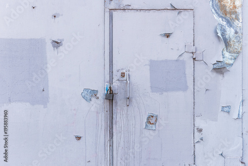 iron gates with bullet holes
