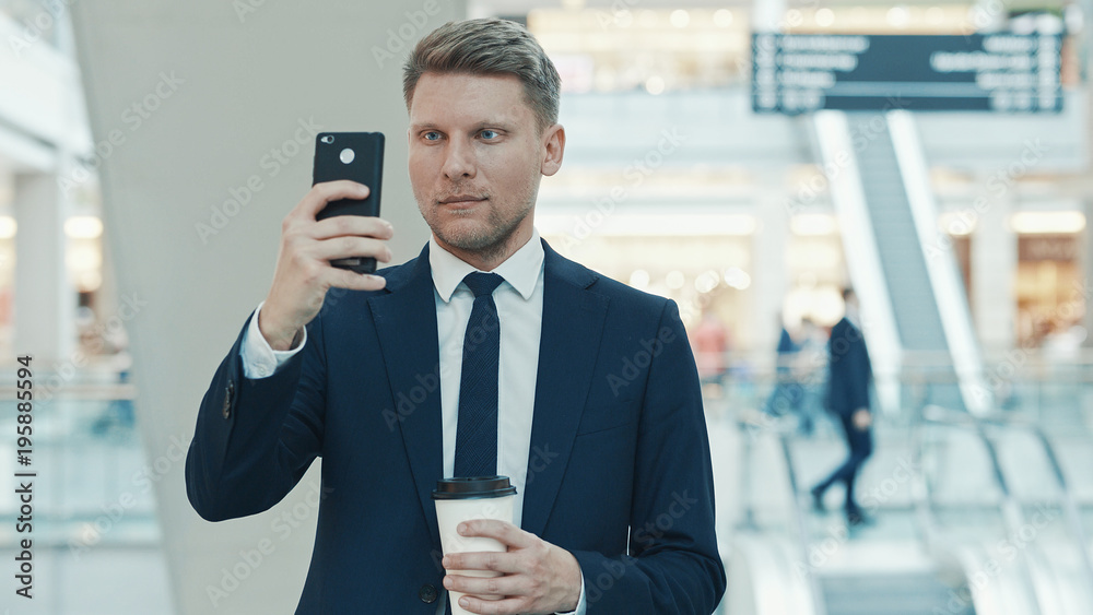 Young businessman making a photo Young businessman making a photo