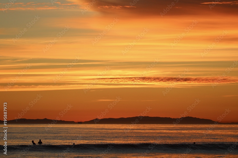 Orange color sunset in Huntington Beach california