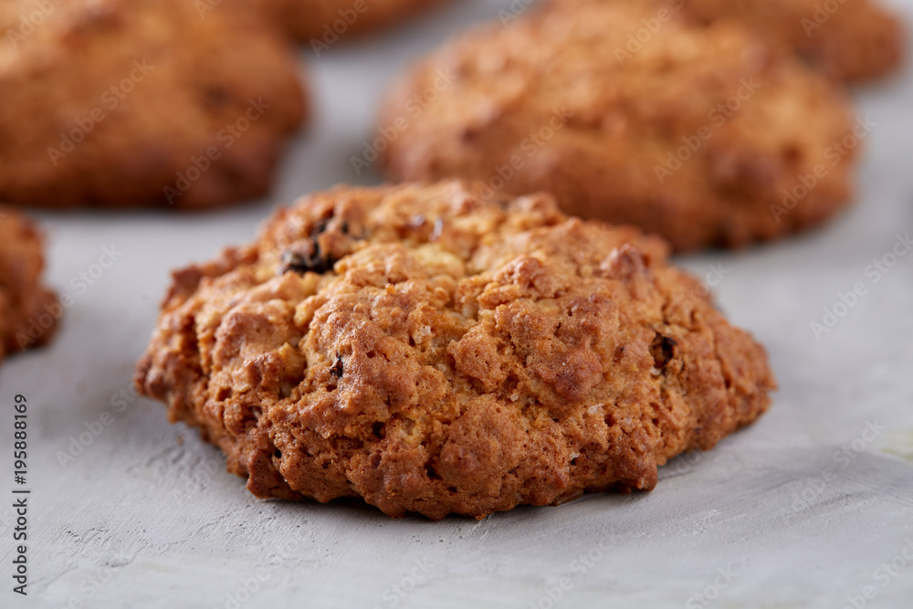 Sweet biscuits arranged in pattern on light textured background, close-up, shallow depth of field, selective focus. Sweet biscuits arranged in pattern on light textured background, close-up, shallow depth of field, selective focus.