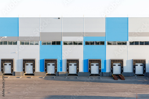 modern logistics center, ramp with gates for loading trucks