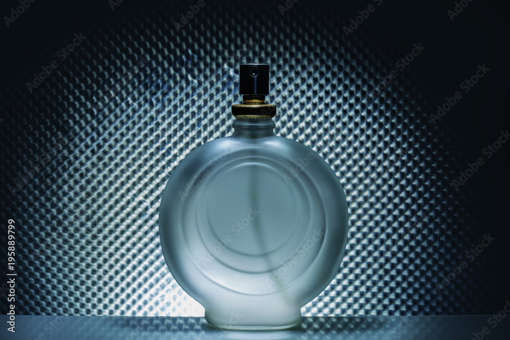 bottle of cologne perfume on a gray light background bottle of cologne perfume on a gray light background