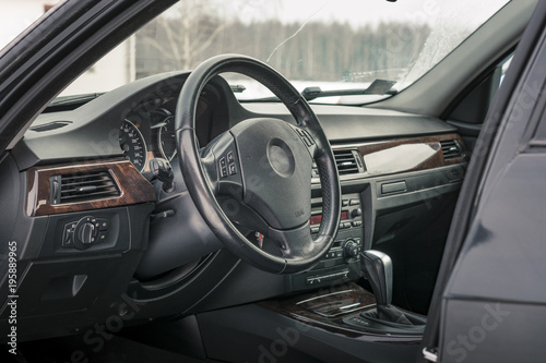 Interior of BMW e90 sedan with recaro type seats. Salon with seats, electronics, gauges, buttons, steering, mirrors and windows. Bayerische Motoren Werke.