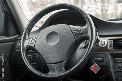 Interior of BMW e90 sedan with recaro type seats. Salon with seats, electronics, gauges, buttons, steering, mirrors and windows. Bayerische Motoren Werke. photo