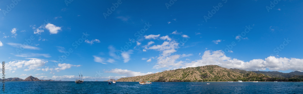 Panoramic blue sky background with white clouds on a sunny day over the sea in Komodo island, East Nusa Tenggara, Indonesia