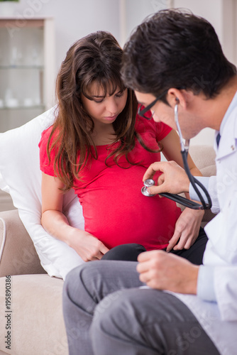 Pregnant woman patient visiting doctor for regular check-up