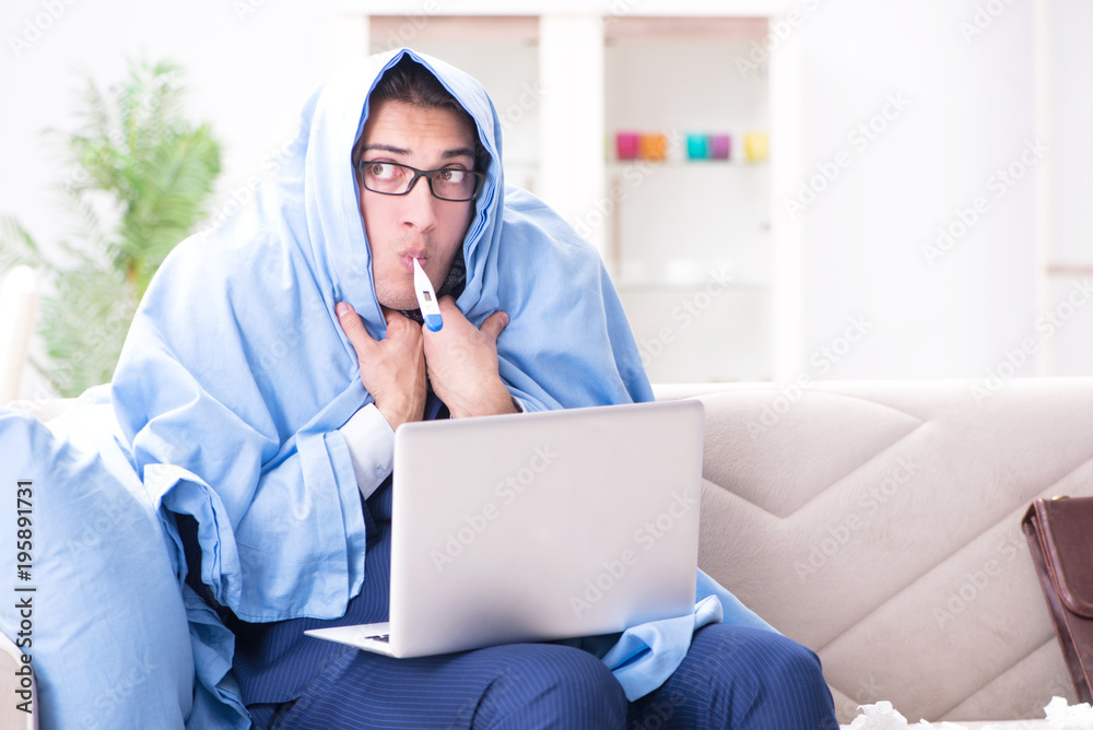 Sick businessman working from home due to flu sickness Sick businessman working from home due to flu sickness
