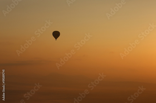 Hot air balloons, atmosphere ballons flying over mountain landscape at Mallorca in the sunrise © lockyfoto