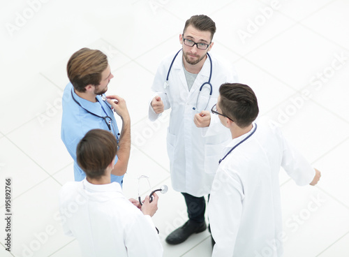 smiling group of doctors discussing
