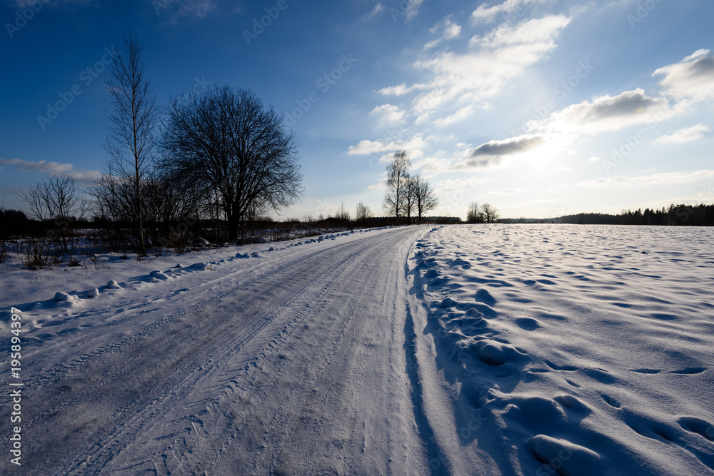 snowy winter road covered in deep snow snowy winter road covered in deep snow