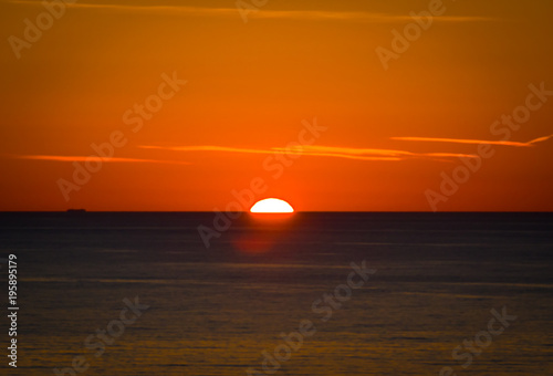 Sunset on the sea with a boat © CalabrianPhoto