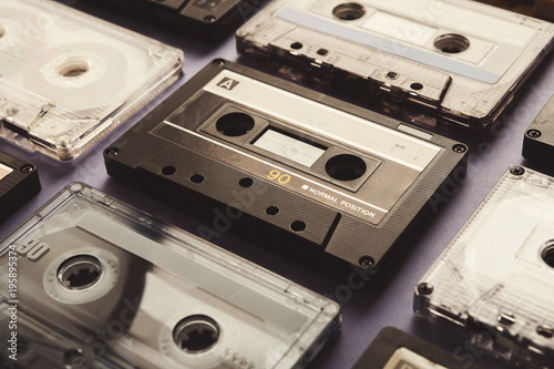 Valokuva Vintage audio cassettes on violet background, closeup
