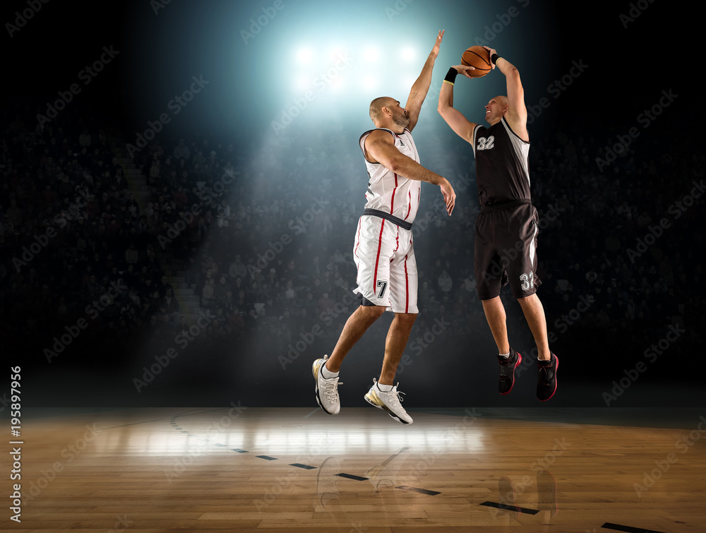 Caucassian Basketball Player in dynamic action with ball in a pr Caucassian Basketball Player in dynamic action with ball in a pr
