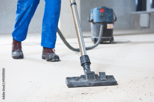 Cuadro en lienzo building cleaning service. dust removal with vacuum cleaner