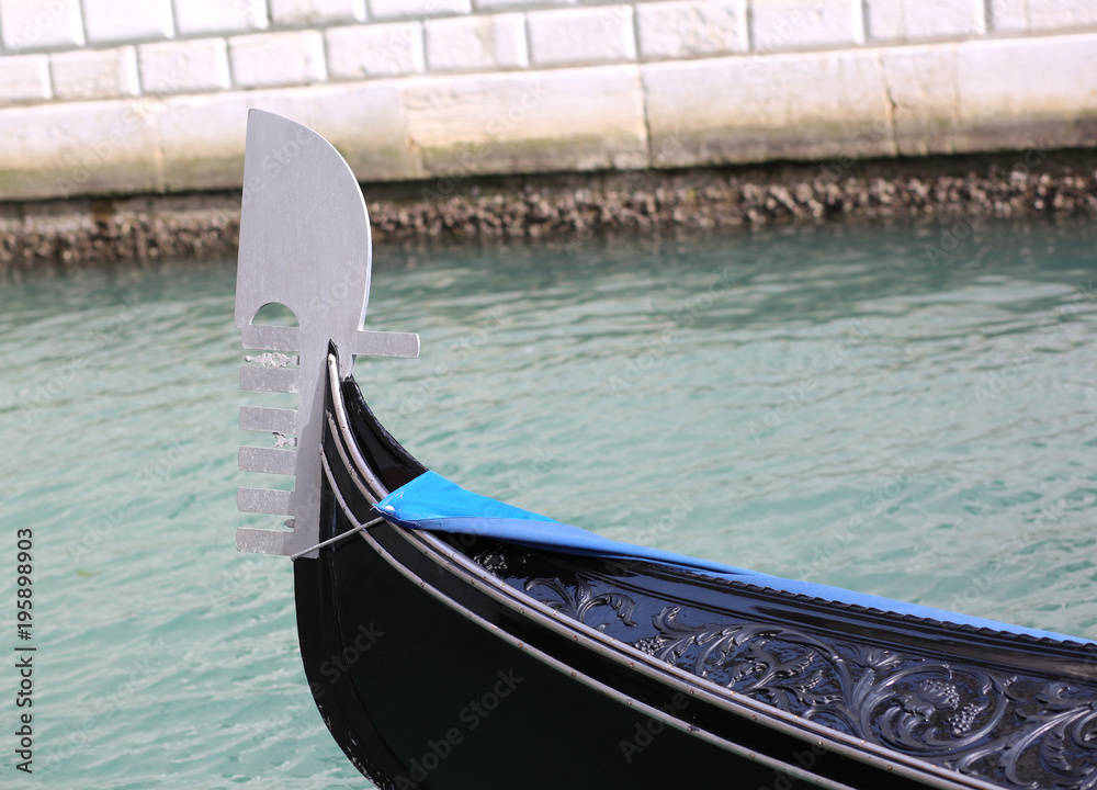 bow of the gondola in a waterway in Venice