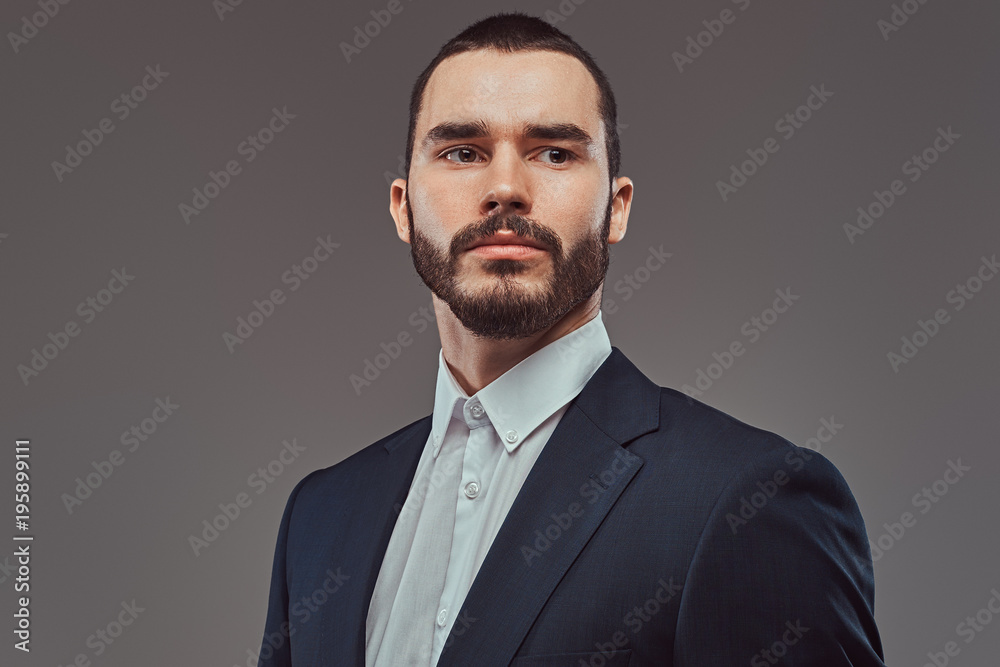 Studio portrait of a brutal bearded businessman wearing a formal Studio portrait of a brutal bearded businessman wearing a formal