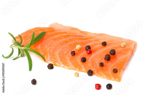 Red fish. Raw salmon fillet with rosemary isolate on white background