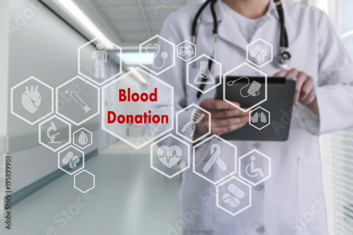 Blood Donation on the touch screen with icons on the background blur medicine Doctor in hospital.Innovation treatment, service, health data analysis. Medical Concept of Blood Donation Save Life . 