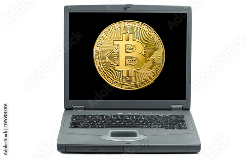 Bitcoin on display of old laptop. Cryptocurrency and digitally concept. Notebook of the past.
