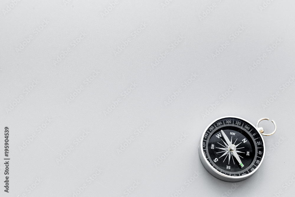 Direction concept with compass on gray background top view mockup Direction concept with compass on gray background top view mockup