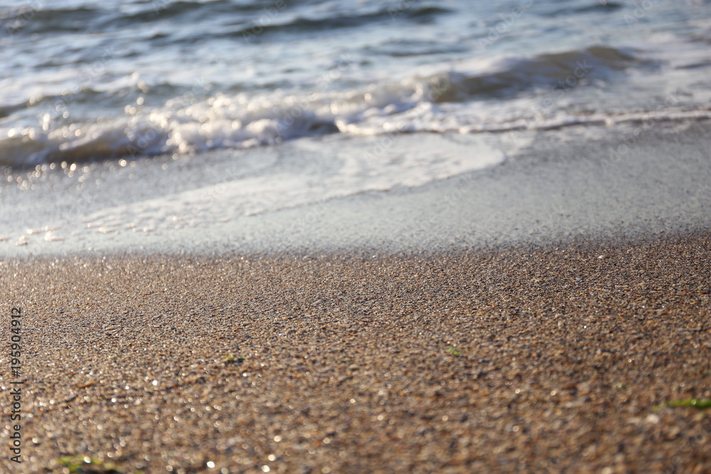 wet sand and waves at the sea cost wet sand and waves at the sea cost