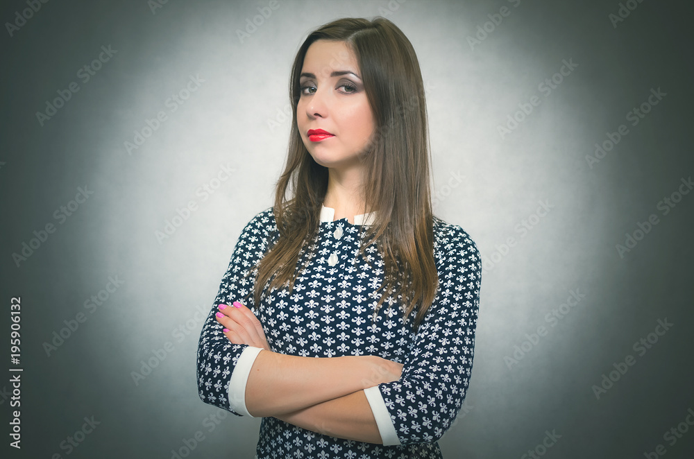 Offended and resentful woman waiting for excuses and explanations and is reproachfully looking isolated on gray background. Offended and resentful woman waiting for excuses and explanations and is reproachfully looking isolated on gray background.