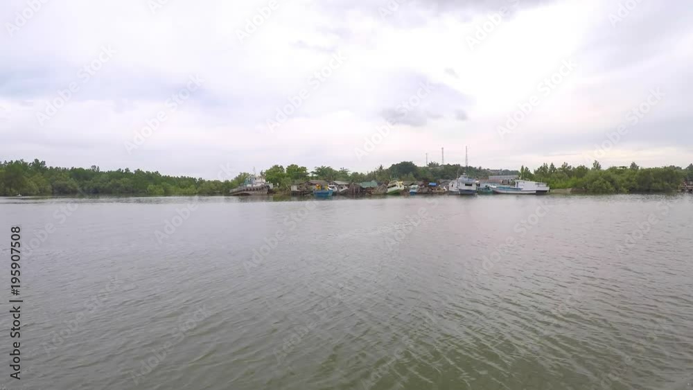 Indonesian fisherman houses and a harbor form a boat on Borneo/Kalimantan Indonesian fisherman houses and a harbor form a boat on Borneo/Kalimantan