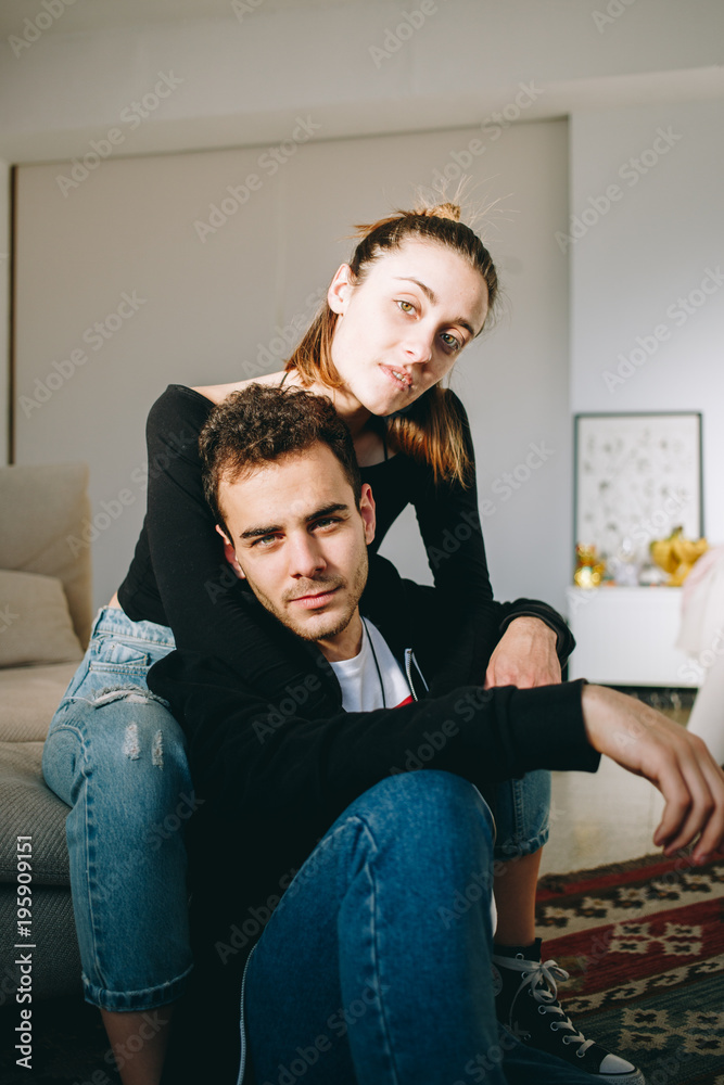 Serious and cool, trendy chic and modern couple portrait, pose inside  amazing authentic room or studio loft for photoshoot. Look into camera like  professional stylish fashion models Stock Photo | Adobe Stock