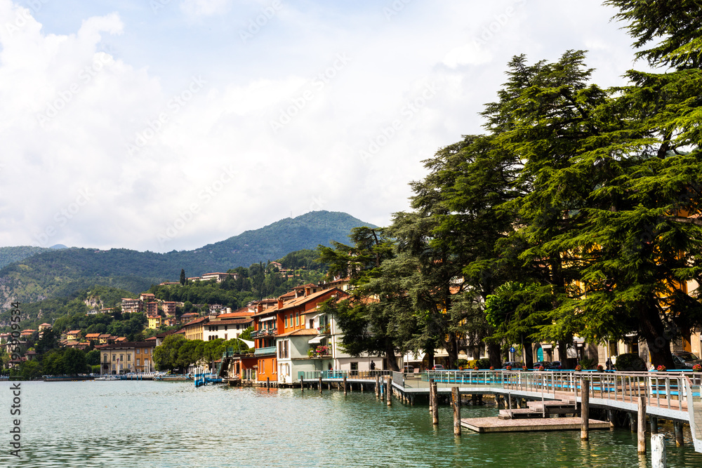 Beautiful embankment overlooking the mountains. Lake Iseo, Italy - architecture and travel background.