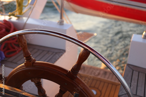 yacht steering wheel at the sea
