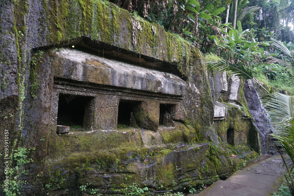 Balinese temple carved in stone with plants