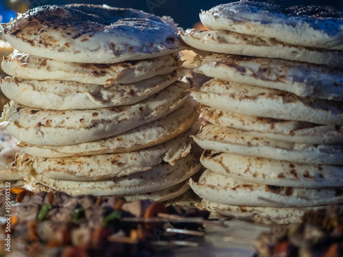 Tw piles of chapati. Typical food on Forodhani Market in Stone Town.  Zanzibar, Tanzania, February 2018. photo