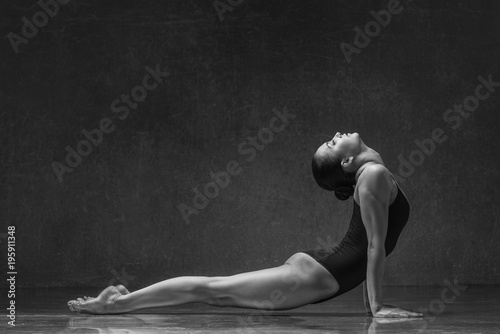 Fototapeta Naklejka Na Ścianę i Meble -  Young yoga woman stretching and training in class 