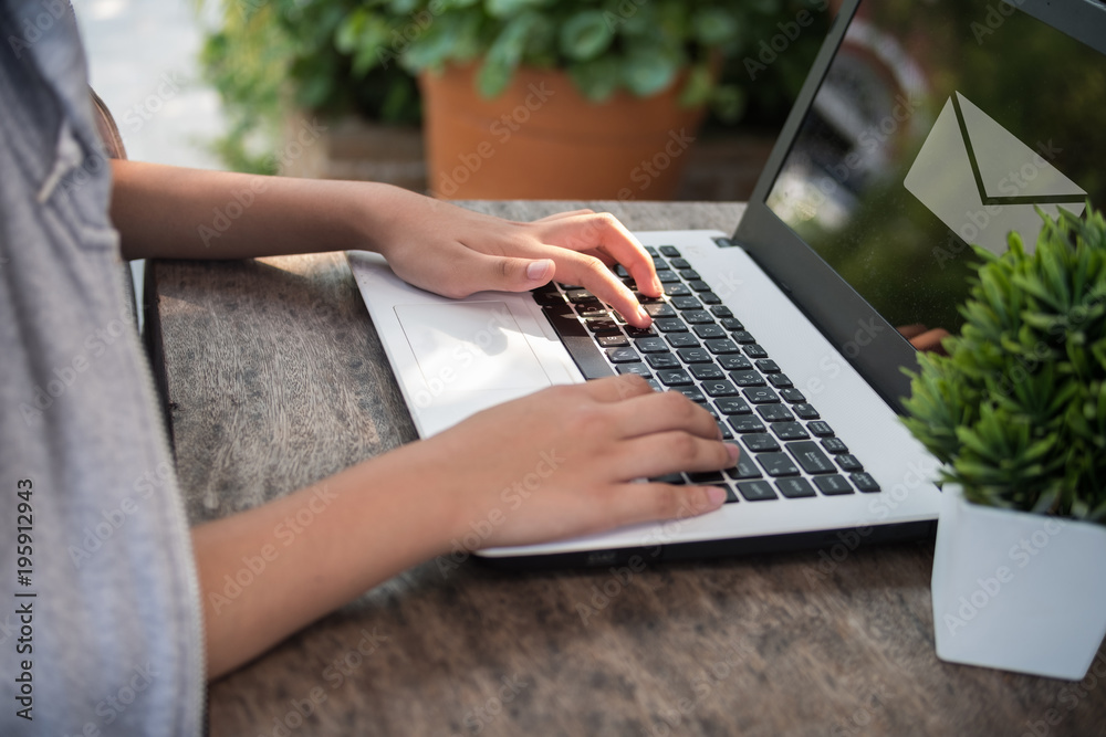 Fototapeta premium Woman used laptop to sent email for her business, technology concept