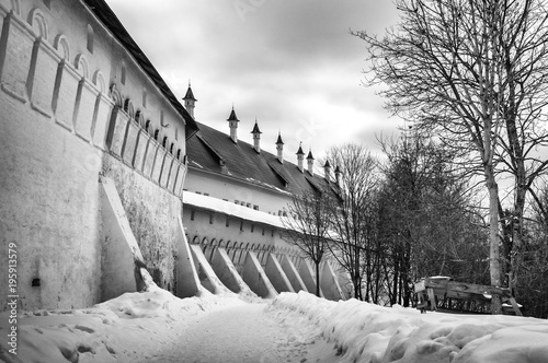 Savvino-Storozhevsky monastery in Zvenigorod in winter day. Moscow region. Architecture of the ancient Russian monastery. Black and white photograph of ancient Russian religious architecture. photo