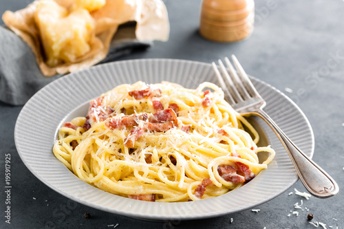 Carbonara pasta, spaghetti with pancetta, egg, hard parmesan cheese and cream sauce. Traditional italian cuisine. Pasta alla carbonara