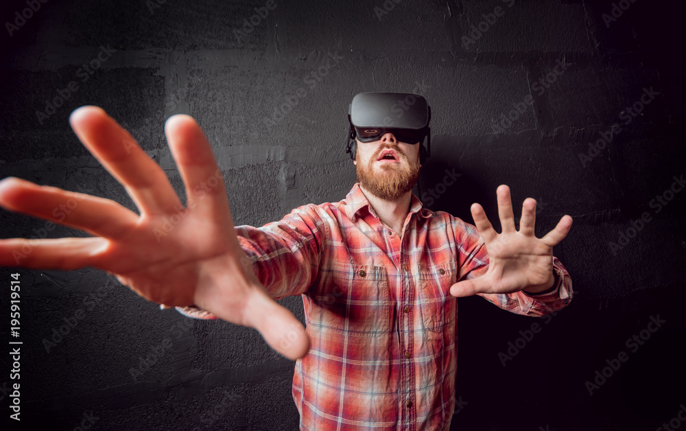 The young man wearing virtual reality goggles The young man wearing virtual reality goggles