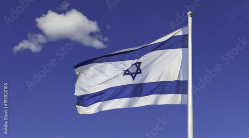 Israel flag in the wind isolated against the sky