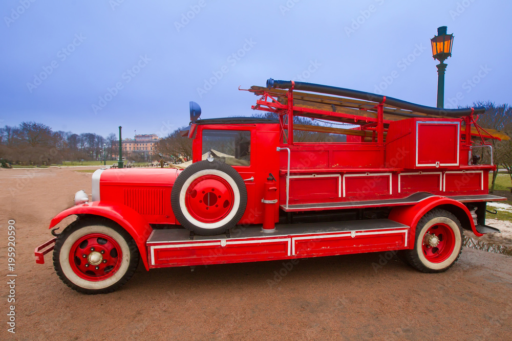 Ancient fire truck of the last century. Red fire truck. Ancient fire truck of the last century. Red fire truck.