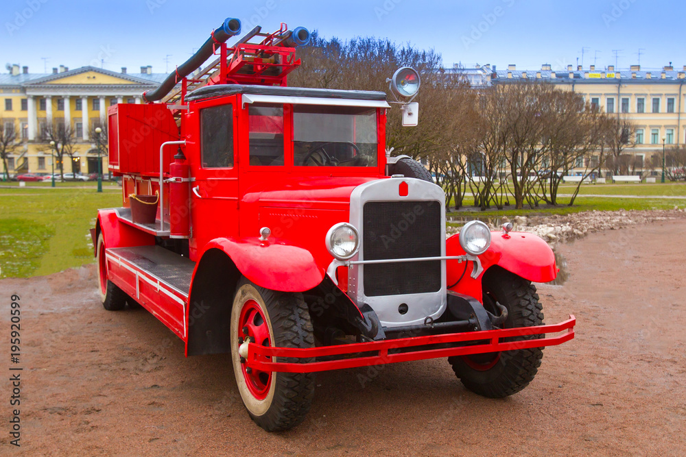 Retro car. Fire team of the last century. The car of firefighters. Red retro car.