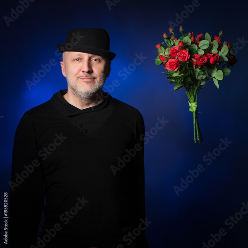 Man with a bouquet of flowe...