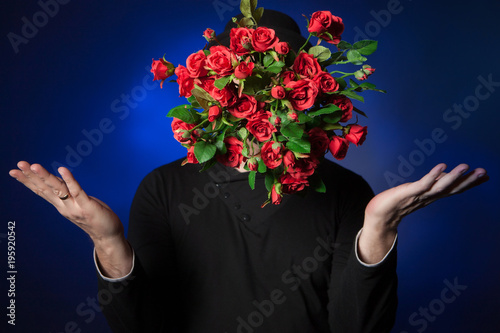 Man with a bouquet of flowe...
