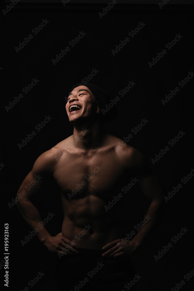 Fototapeta premium Portrait of young asian boy with fitness body.