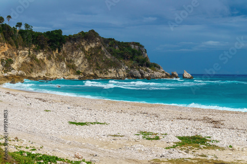 Ideal Caribbean empty beach with azure sea and green rocks © Sandra