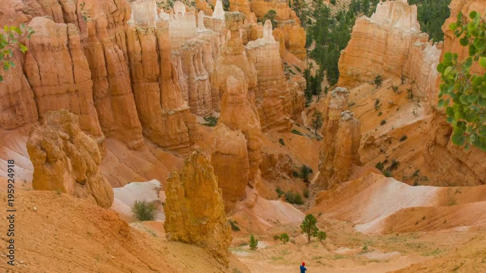 Panoramic view at the cliffs. Spectacular ravine. Tourists walking along the trail. Nature video. Amazing mountain landscape.Bryce Canyon National Park. Utah. USA. 4K, 3840*2160, high bit rate, UHD Panoramic view at the cliffs. Spectacular ravine. Tourists walking along the trail. Nature video. Amazing mountain landscape.Bryce Canyon National Park. Utah. USA. 4K, 3840*2160, high bit rate, UHD