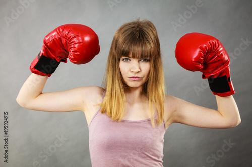 Woman wearing boxing gloves