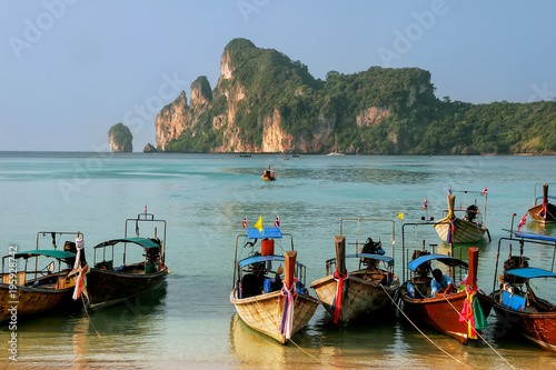 Longtail boats anchored at Ao Loh Dalum beach on Phi Phi Don Island, Krabi Province, Thailand photo