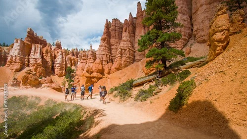 Wallpaper Mural Narrow footpath among yellow cliffs. Spectacular view at the cliffs. Tourists are walking along the trail. Bryce Canyon National Park. Utah. USA. 4K, 3840*2160, high bit rate, UHD Torontodigital.ca