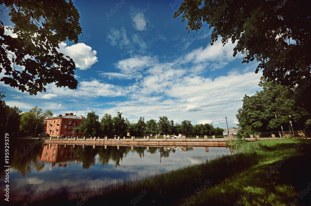 Pushkin city view with blue sky with reflections on the water and coach Pushkin city view with blue sky with reflections on the water and coach